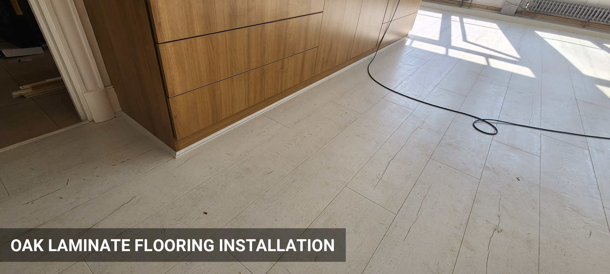 QuickStep Capture Painted Oak White Laminate Flooring Installation in Covent Garden