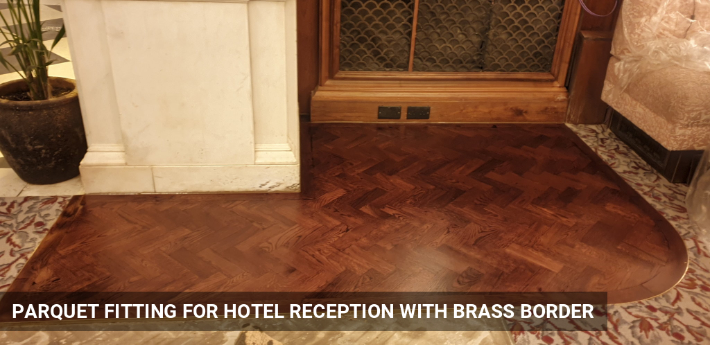 Installation of Parquet Flooring Base for Hotel Reception within Carpets with Brass Border Around in Central London